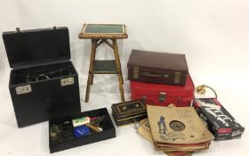 Assorted suitcases and small green tiled square two-tier occasional table and a Singer sewing