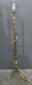 Modern brass standard lamp with scroll decoration