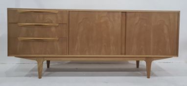 20th century McIntosh teak sideboard with two cupboard doors and three drawers, on tapering