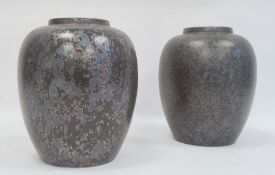 Two Poole pottery vases, black calypso lustre pattern, marked to base, 21cm high (2)