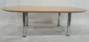 Light oak coffee table with rounded ends, on chrome supports, marked underneath 'Brevettato',