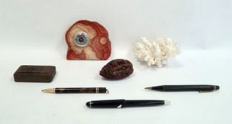 Two vintage propelling pencils, a carved wooden nut-shaped box, another carved wooden box, an