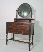 20th century oak dressing chest, the circular mirror on barleytwist supports above two drawers,