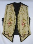 Mid 19th century front panels of a gentleman's waistcoat, machine embroidered, the black satin