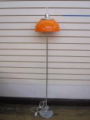 Harvey Guzzini mushroom-shaped floor lamp with orange shade, chrome finial and base, with label