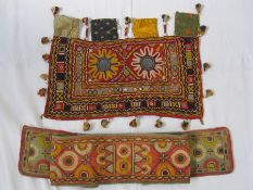 Indian embroidered piece with mirror detail, shell and tassel fringes and another Eastern