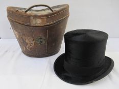 Gieves Limited silk top hat (small tear to the fabric in the rim) within original fitted leather hat