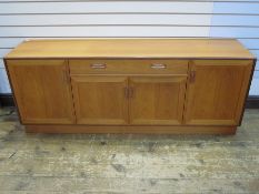 Mid 20th century G-Plan teak sideboard with curved bar handles, single drawer above cupboard,