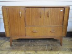 E Gomme Brandon range, G-plan sideboard, three cupboards and drawer below on tapering supports,