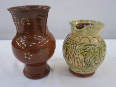 Studio pottery jug in yellow decorated with birds, 16.5cm high and another studio pottery jug,