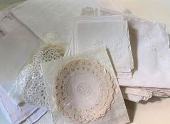 Assorted table linen to include damask napkins, embroidered tablecloths, etc (1 bag)