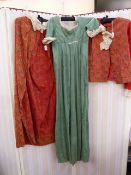 Part made lawn empire-style dress with boned bodice, a paisley print jacket with plain red sleeves