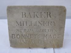 Stone advertising plaque 'Baker Millinery Straw and Drawn Bonnets Made and Altered', 25.5cm x