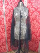 Large black lace on net, triangular-shaped shawl, a lace collar, a length of lace, possibly cut