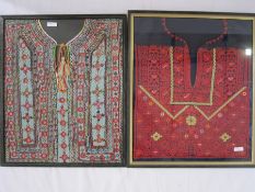 Embroidered Palestinian dress front, framed, a Bedouin dress front, framed, a tribal dress front