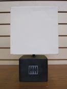 20th century table lamp and white shade, square-shaped, the black base with abstract design,