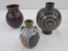 Two Rupert Andrews studio pottery vases in purple, 13.5cm and 11cm high and David Eeles studio