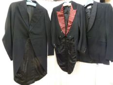 Three vintage dinner suits, one tail coat , one morning suit jacket and various trousers and a