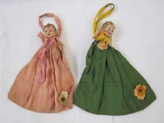 1940's lavender/mothball cloth pouches with plastic doll heads (one broken)