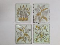 Four hand painted Aesthetic-movement glass panes or quarries, florally decorated, circa 1870,