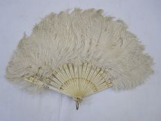 Small ostrich feather fan with bone sticks and guards, with gilt decorations