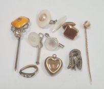 Miniature gilt-coloured and enamel heart-shaped memorial pendant enclosing hair with single white