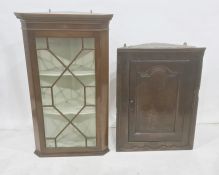 Mahogany wall-hanging corner display cabinet with astragal-glazed door enclosing three shelves and