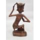 Assorted 20th century Eastern carved figures to include figure in hat carrying jug and basket, - Image 7 of 9