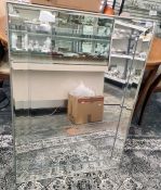 Modern rectangular wall mirror of plain form with bevelled panels, 76 x 107cm