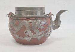 Redware and white metal clad teapot with twin metal loop handle, dragon decorated