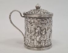 Chinese Wang Hing embossed silver mustard pot, cylindrical and lidded, decorated autour with figures