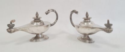 Pair silver table lighters, each in the form of Roman lamp with free scroll eagle's head handles,