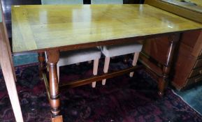 20th century oak rectangular dining table with cleated end supports, turned block legs to