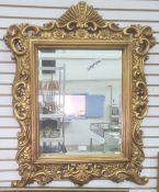 Rectangular bevel edge mirror in gilt-coloured moulded frame, of foliate design, 83cm x 65cm overall