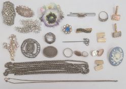 Quantity of silver brooches, a silver-coloured metal chain, a stickpin and two silver-coloured metal