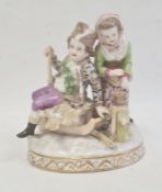 Dresden porcelain group of woodcutter and girl with brazier, 18cm high