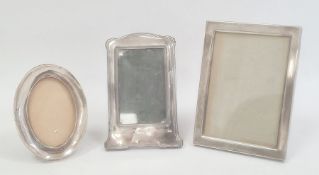 An early 20th century silver mounted photograph frame, Birmingham 1913, a 1930s circular silver