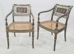Set of six Regency-style ebonised dining open arm chairs, each with a panel decorated with classical