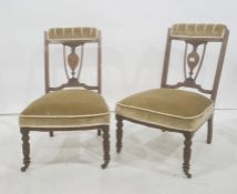 Pair of 19th century low chairs with mahogany inlaid frames, turned front legs to brown china