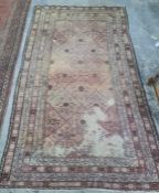 Eastern rug with diamond pattern to the central field, stepped border, 310 x 191cm