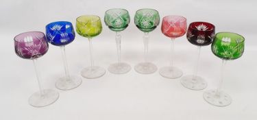 Set of six harlequin coloured hock glasses and two further (8) together with a tray of flatware