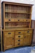 Modern pine dresser, the plate rack fitted with three open shelves and three short drawers, the base