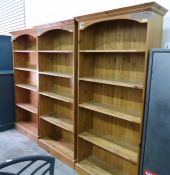 Set of three tall pine open bookcases each with stepped cornice over five open shelves, 92cm wide