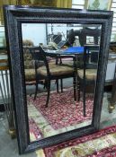 Modern black painted wall mirror of rectangular form with bevel mirror plate, 110cm x 80cm