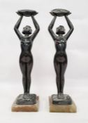 Pair of Limousin bronze Art Nouveau figures of ladies holding aloft baskets of flowers
