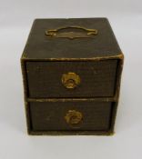 Miniature cupboard chest of two drawers and contents of gaming counters and Mahjong tiles