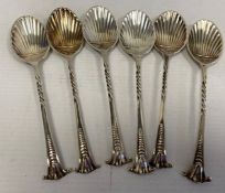 A set of six Victorian silver teaspoons, scallop shaped with art nouveau handles, makers William