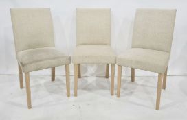 Four modern fabric-covered dining chairs (4)