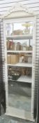 Full length white painted wall mirror with arched carved pediment, the mirror plate flanked by
