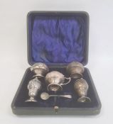 An early 20th century silver cruet set, Art Nouveau decoration and form, Birmingham 1908, maker